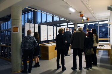 Guests take a look at the design plans and models of the graduates on display as part of the exhibition.