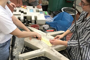 Students remove the formwork from their façade panel.