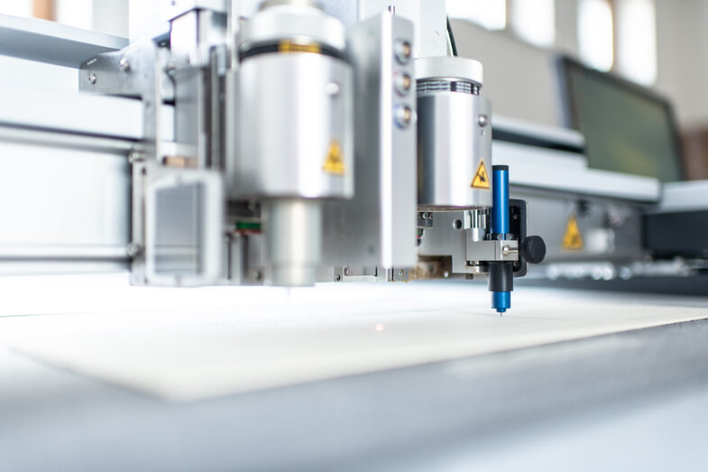 Close-up of a cutting plotter in a workshop.