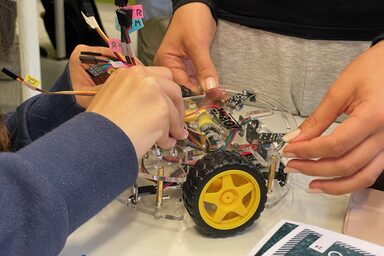Pupils build a model car.