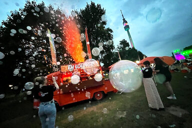 The FH vintage car with an illuminated fountain of fog and lots of soap bubbles.