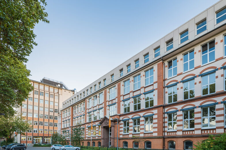 Photo of the old building and the skyscraper on Sonnenstrasse across the parking lot. __ <br>View of the old building and the skyscraper on Sonnenstrasse across the parking lot.